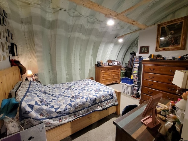 carpeted bedroom with vaulted ceiling