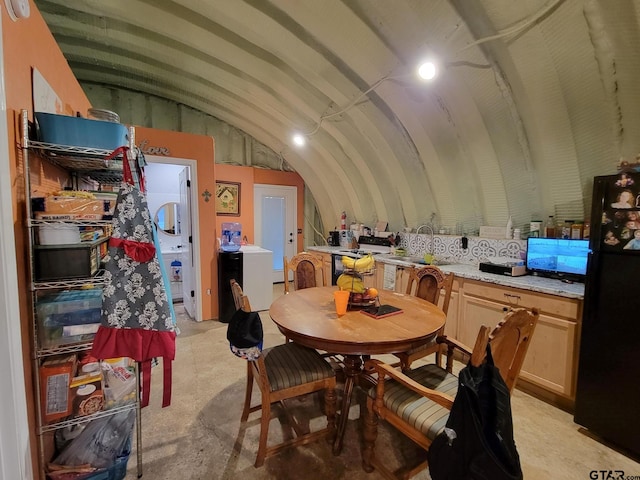 dining area with lofted ceiling