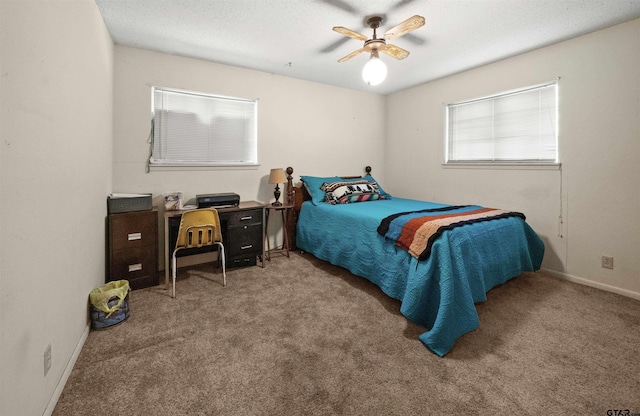 bedroom with ceiling fan and carpet