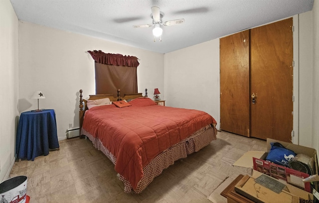 bedroom featuring baseboard heating and ceiling fan