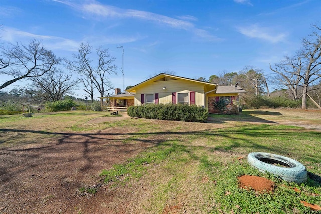 view of side of property featuring a yard