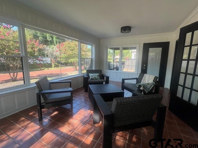 sunroom / solarium with vaulted ceiling