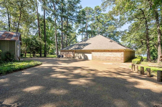 view of home's exterior with a garage