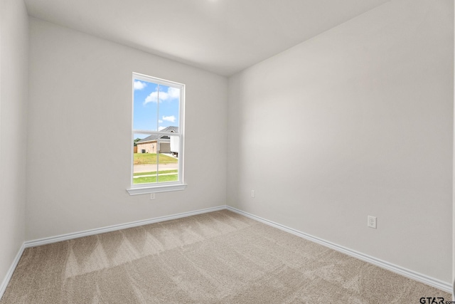 empty room with light colored carpet