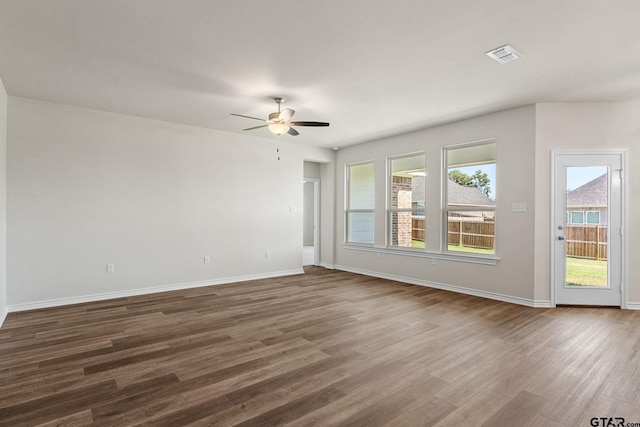 unfurnished room featuring ceiling fan and hardwood / wood-style floors