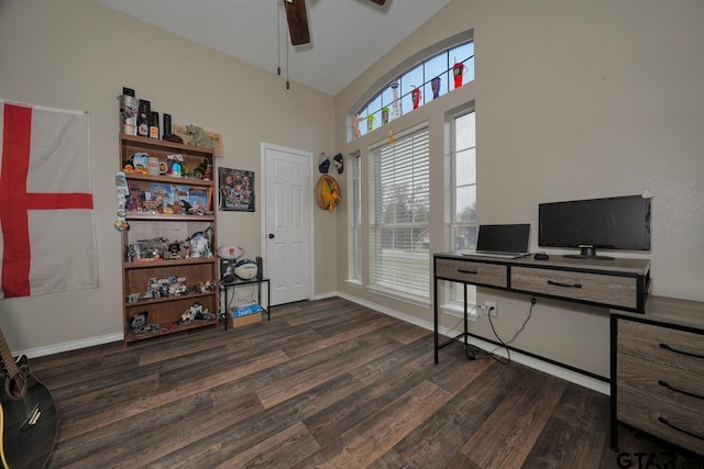 office featuring dark wood-style floors, high vaulted ceiling, ceiling fan, and baseboards