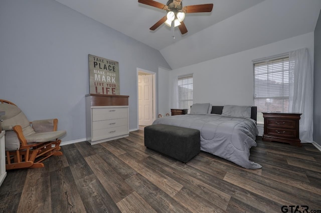 bedroom with lofted ceiling, multiple windows, dark wood finished floors, and baseboards