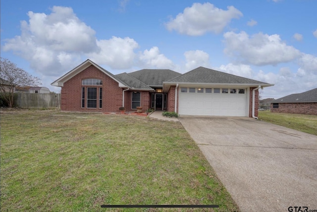 single story home featuring driveway, a garage, brick siding, fence, and a front yard