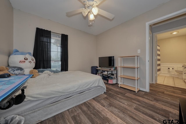 bedroom with ceiling fan and dark wood finished floors