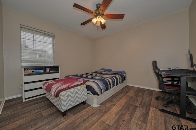 bedroom featuring dark wood-style floors, baseboards, and a ceiling fan