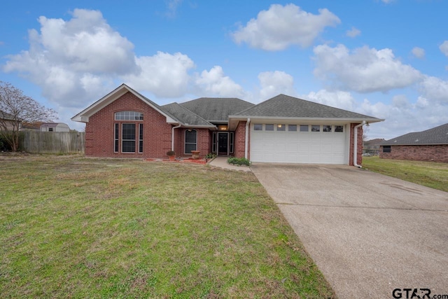 ranch-style house with a front lawn and a garage