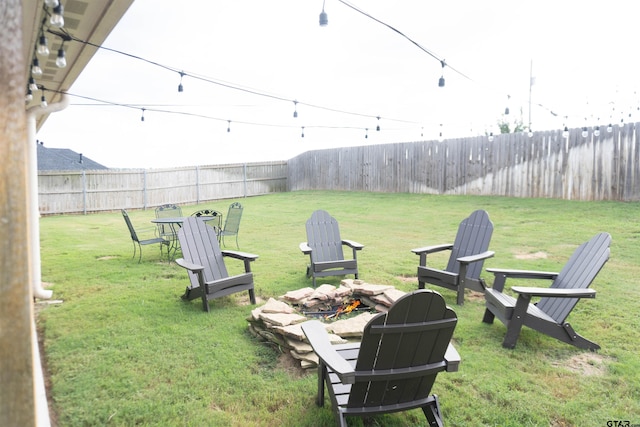 view of yard featuring an outdoor fire pit