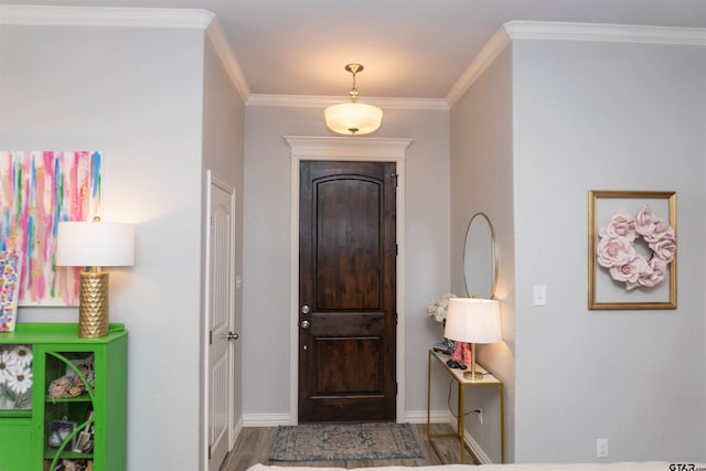 entrance foyer with hardwood / wood-style flooring and crown molding