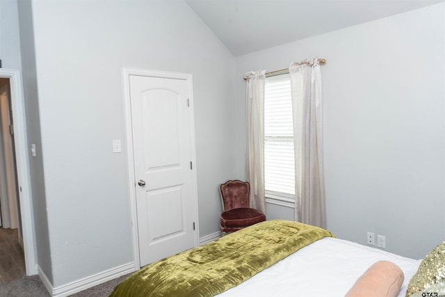 bedroom featuring lofted ceiling