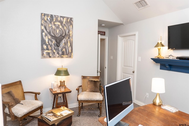 living area with carpet floors and lofted ceiling