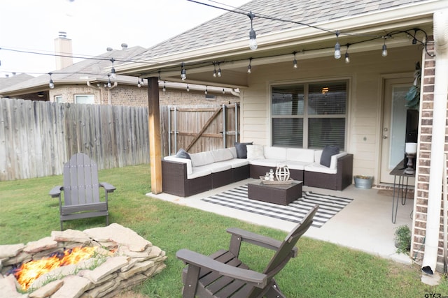 view of yard with a patio and an outdoor living space with a fire pit