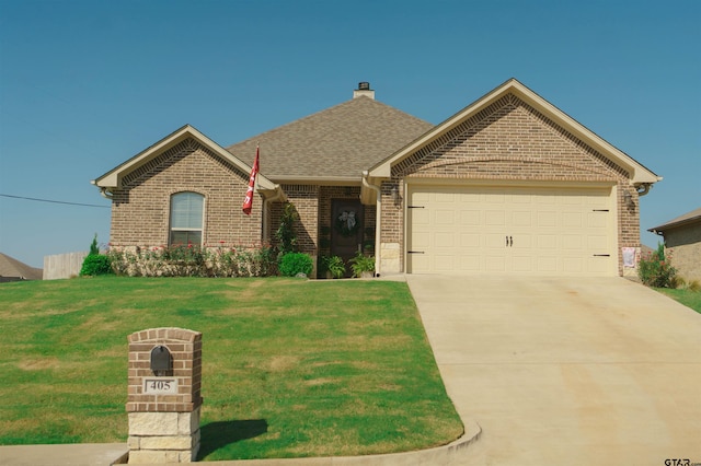 ranch-style house with a garage and a front yard