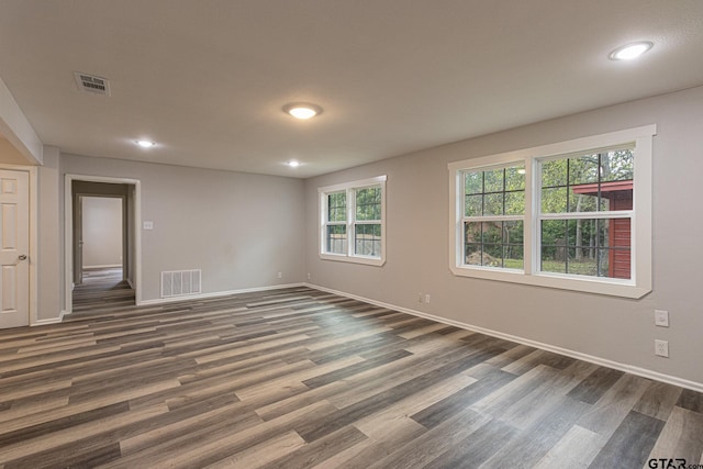 empty room featuring dark wood-type flooring