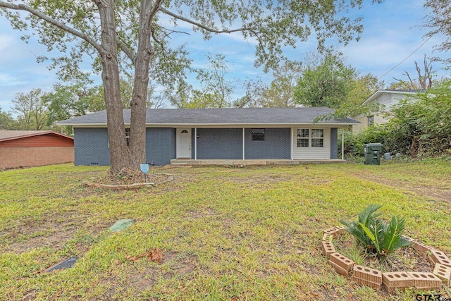 back of house featuring a yard