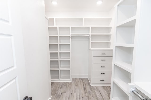 spacious closet with light wood finished floors