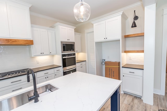 kitchen featuring open shelves, oven, white cabinets, and built in microwave