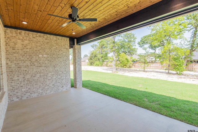 view of patio with ceiling fan and fence