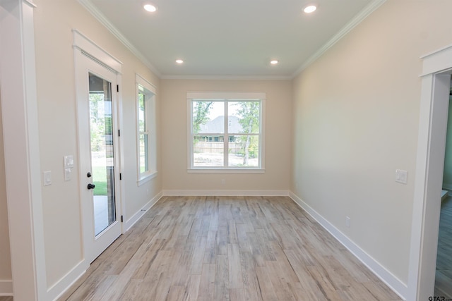 unfurnished room with recessed lighting, light wood-type flooring, crown molding, and baseboards