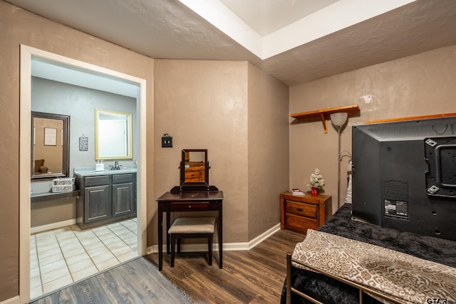 interior space with sink and hardwood / wood-style flooring