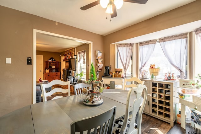 dining area featuring dark hardwood / wood-style floors and ceiling fan