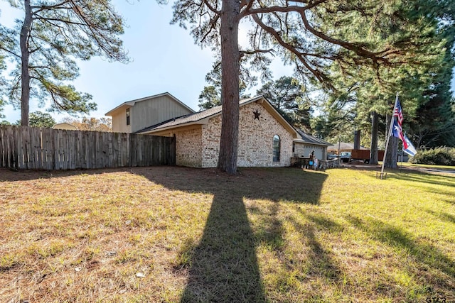 view of property exterior with a yard