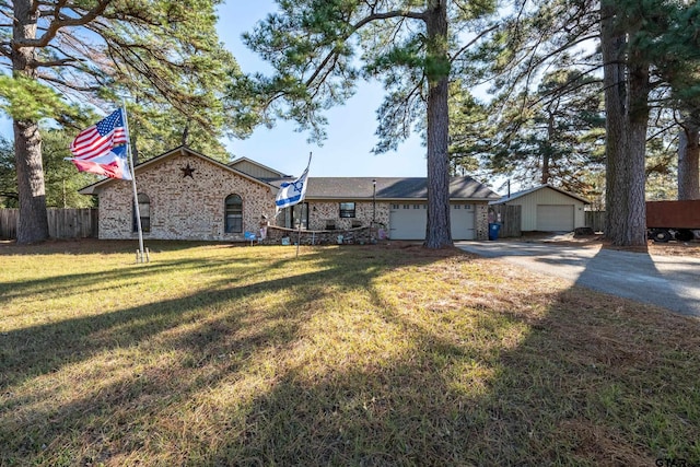 view of front of home with a garage and a front lawn