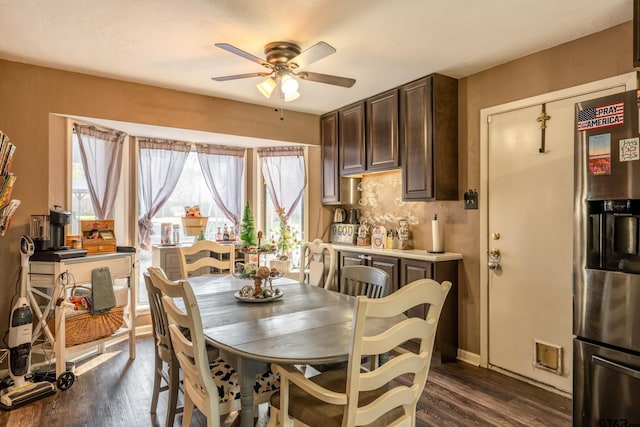 dining area with dark hardwood / wood-style floors and ceiling fan