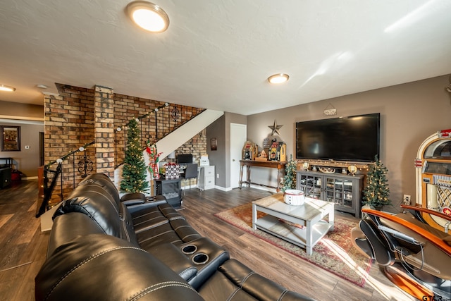 living room with a fireplace and dark hardwood / wood-style floors