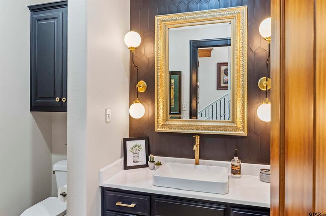 bathroom with vanity and toilet