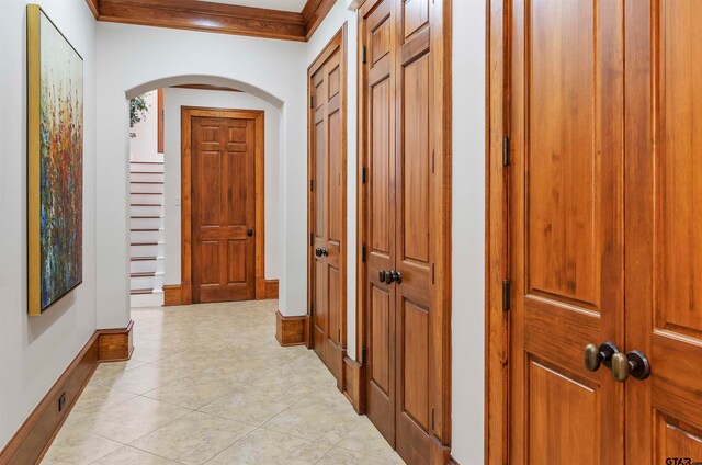 corridor featuring ornamental molding