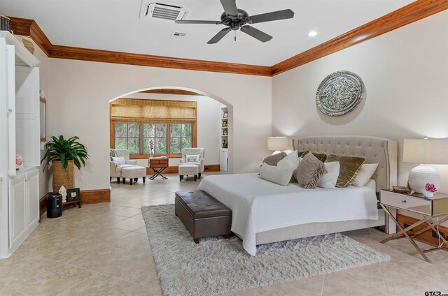 bedroom featuring ceiling fan, ornamental molding, and light tile patterned floors