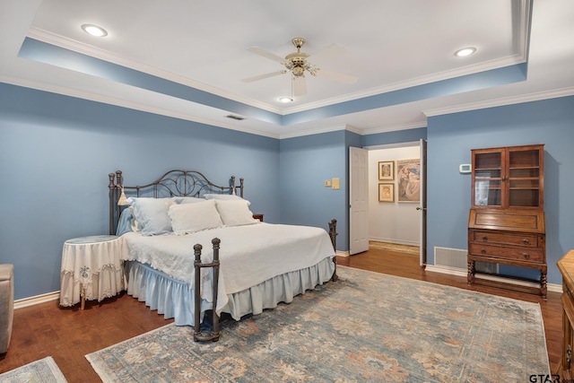 1807 Royal Oak Dr, Tyler, TX 75703 - bedroom with a raised ceiling, wood finished floors, crown molding, ceiling fan, and recessed lighting