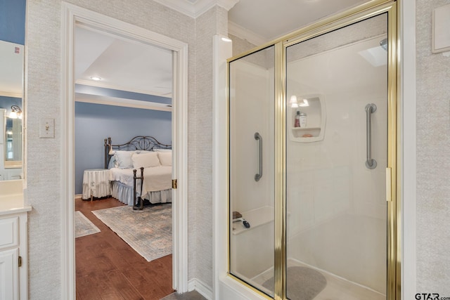 1807 Royal Oak Dr, Tyler, TX 75703 - bathroom featuring ornamental molding, connected bathroom, wood finished floors, a shower stall, and vanity