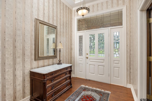 1807 Royal Oak Dr, Tyler, TX 75703 - foyer with ornamental molding, wallpapered walls, and dark wood-style flooring