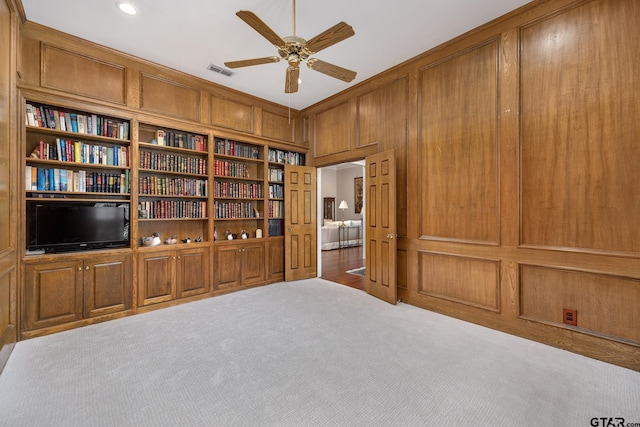 1807 Royal Oak Dr, Tyler, TX 75703 - sitting room with carpet floors, ceiling fan, wooden walls, and recessed lighting