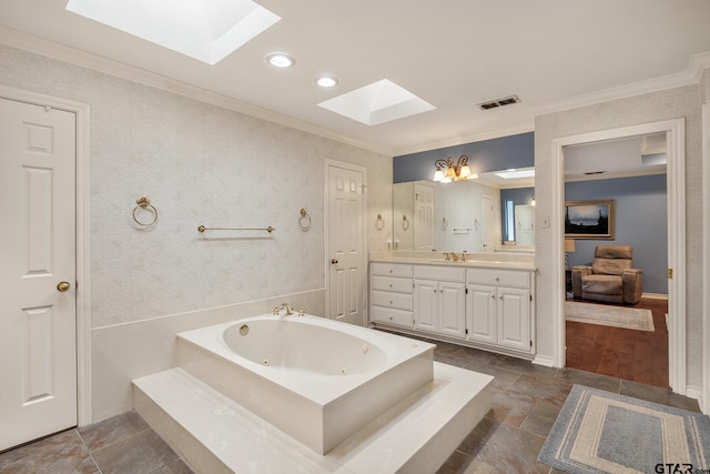 1807 Royal Oak Dr, Tyler, TX 75703 - bathroom featuring a skylight, vanity, ornamental molding, a jetted tub, and recessed lighting