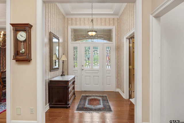 1807 Royal Oak Dr, Tyler, TX 75703 - foyer entrance featuring wood-type flooring, wallpapered walls, a tray ceiling, and ornamental molding