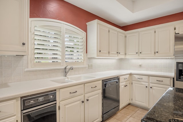 1807 Royal Oak Dr, Tyler, TX 75703 - kitchen with black dishwasher, white cabinets, light tile patterned flooring, and decorative backsplash