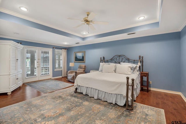 1807 Royal Oak Dr, Tyler, TX 75703 - bedroom featuring access to exterior, french doors, wood finished floors, ornamental molding, and a raised ceiling