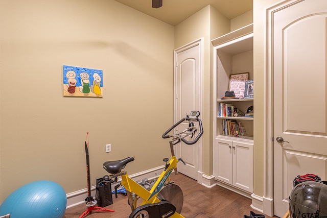 workout area with dark wood-type flooring