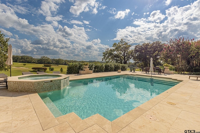 view of pool with a patio and an in ground hot tub