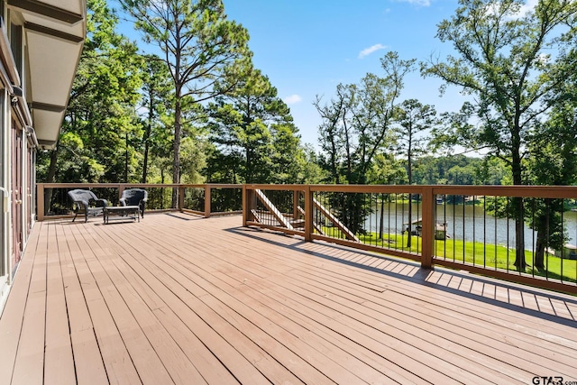 wooden deck with a water view