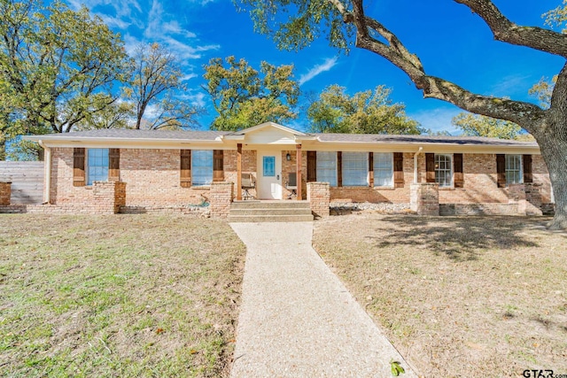 single story home featuring a front yard and a porch