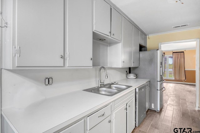 3316 Lynnwood Dr, Tyler, TX 75701 - kitchen with a sink, appliances with stainless steel finishes, and light countertops
