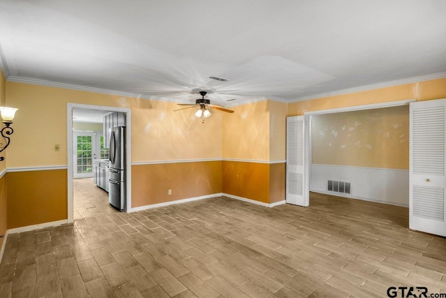 3316 Lynnwood Dr, Tyler, TX 75701 - empty room with a ceiling fan, wood finished floors, crown molding, and baseboards